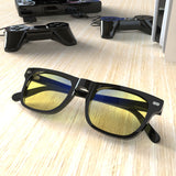Sleepaxa AstroLuxe Jet Black gaming & computer glasses with yellow blue-light filter – lifestyle view