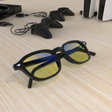 Sleepaxa Eclat Jet Black gaming & computer glasses with yellow blue-light filter – lifestyle view