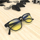Sleepaxa Seraphic Gun Black gaming & computer glasses with yellow blue-light filter – lifestyle view