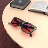 Lifestyle Lenses View of Sleepaxa Orion Rifle FL-41 Migraine Glasses with black frame, Acetate temples, and rose-tinted lenses with blue block and blue anti reflection properties , designed with smooth high-quality Acetate frame material for Migraine & Light Sensitivity